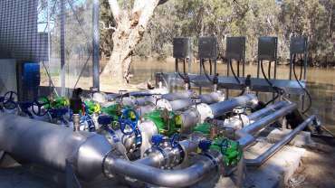 A set of Bermad 43Q pressure relief valves next to a river