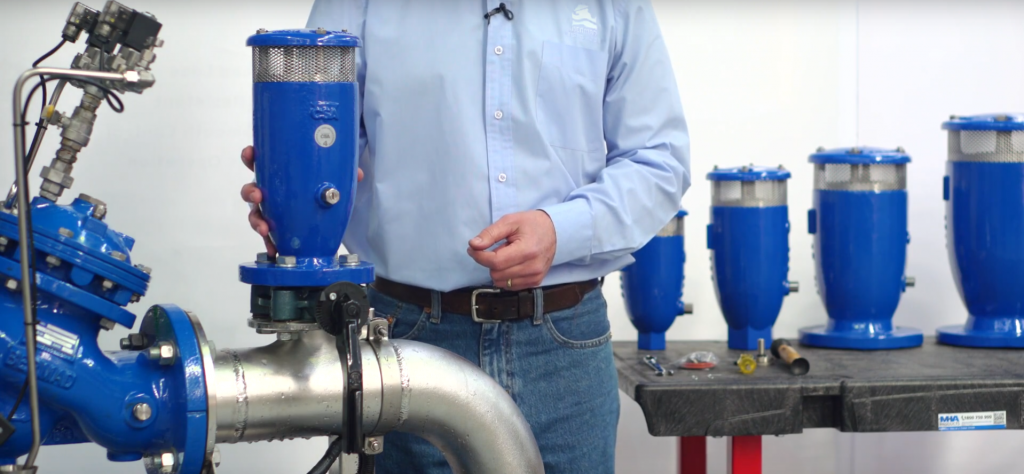 A Bermad Employee showcasing a water valve product